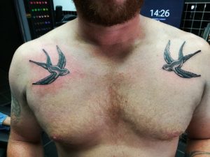 swallow tattoo, chest tattoo, traditional tattoo
