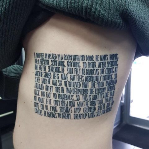 written tattoo, lettering tattoo, song lyric tattoo.