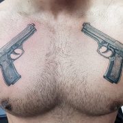 guns on chest, gun tattoo, tattoos for men